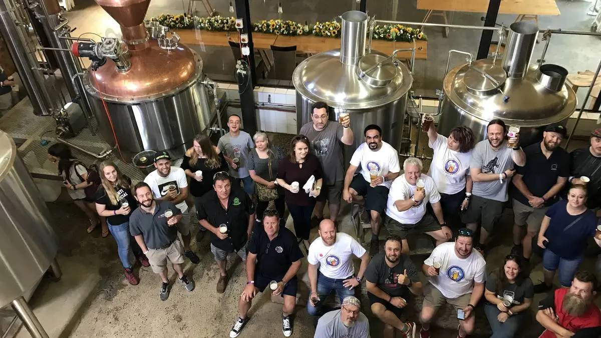 Tour group in front of Brewing and Distilling equipment